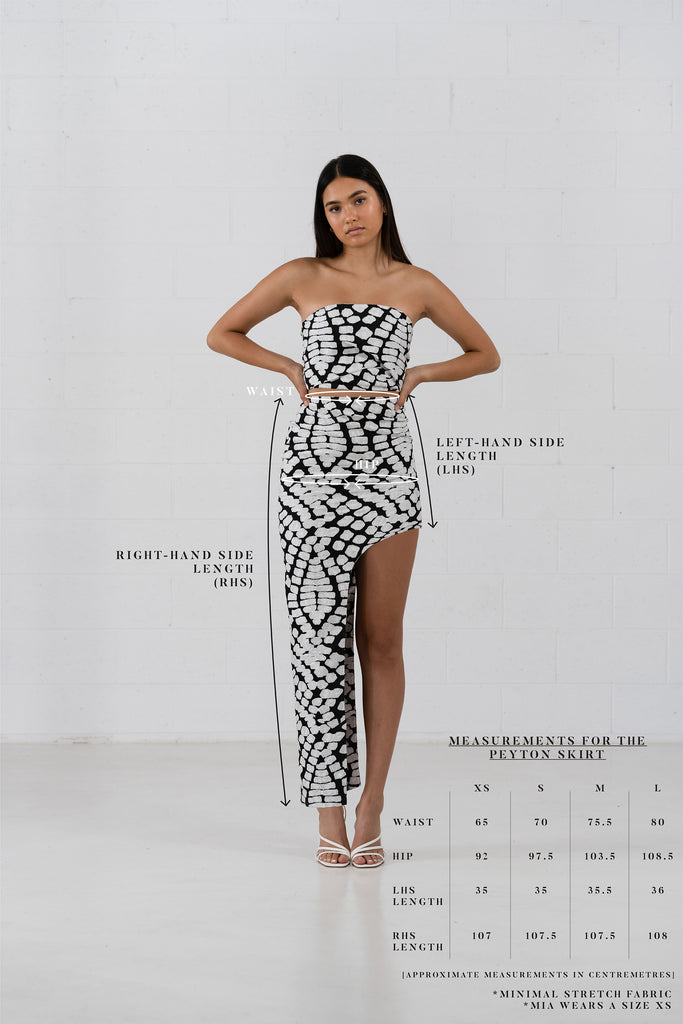 Size Chart. The Peyton skirt in an asymmetrical design. Black and white pattern fabric.