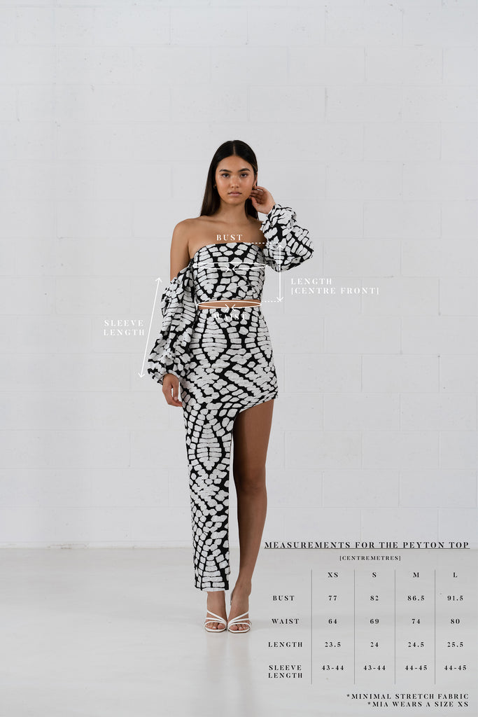 Size Chart. The Peyton Top is a structural bodice crop with with detachable ruffle sleeves. Designed in a textured abstract black and white pattern fabric.